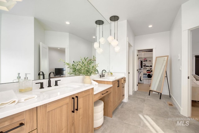 bathroom featuring tile patterned floors and vanity