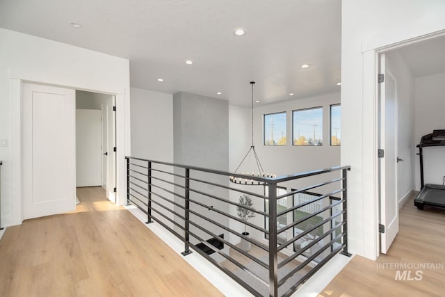 corridor with light hardwood / wood-style floors