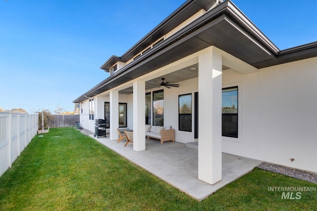 exterior space featuring a patio, an outdoor hangout area, ceiling fan, and a lawn