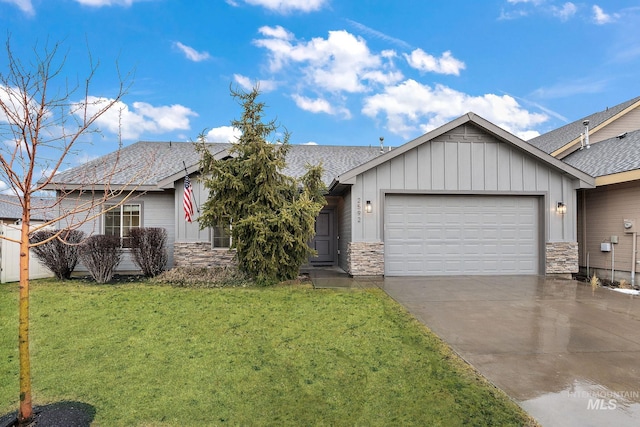 ranch-style house featuring an attached garage, board and batten siding, stone siding, driveway, and a front lawn