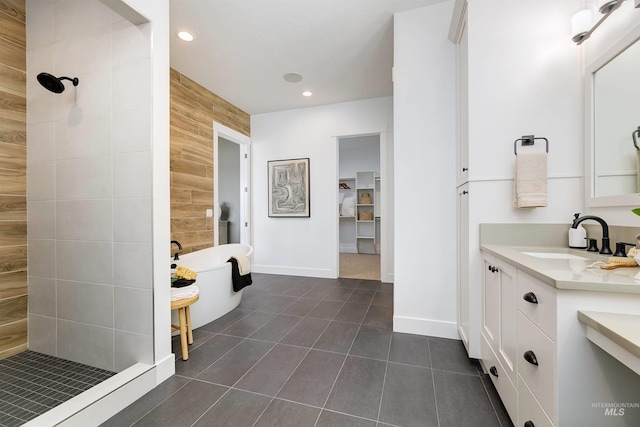 full bath with a walk in shower, vanity, recessed lighting, a soaking tub, and tile patterned floors