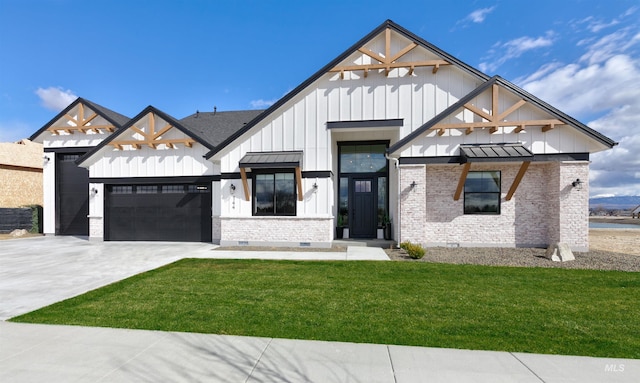 modern farmhouse style home with board and batten siding, a garage, a front lawn, driveway, and a standing seam roof