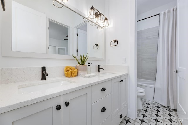 bathroom featuring toilet, double vanity, shower / tub combo with curtain, and tile patterned floors