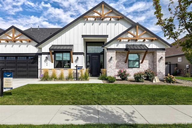 view of front of home with board and batten siding, a garage, a front lawn, driveway, and a standing seam roof