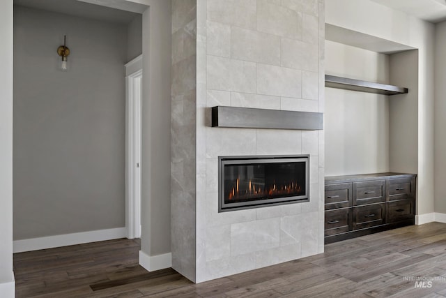 unfurnished living room with light hardwood / wood-style floors and a tile fireplace