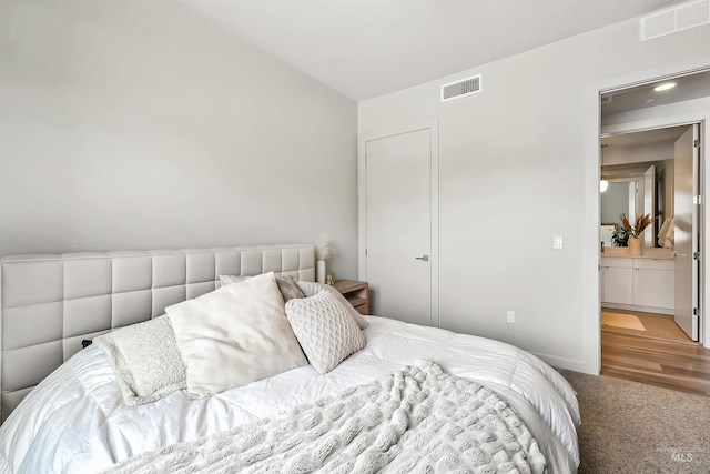 bedroom featuring visible vents and carpet floors