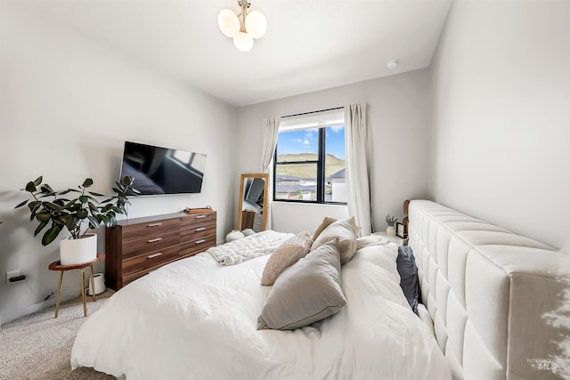 bedroom with baseboards and carpet floors