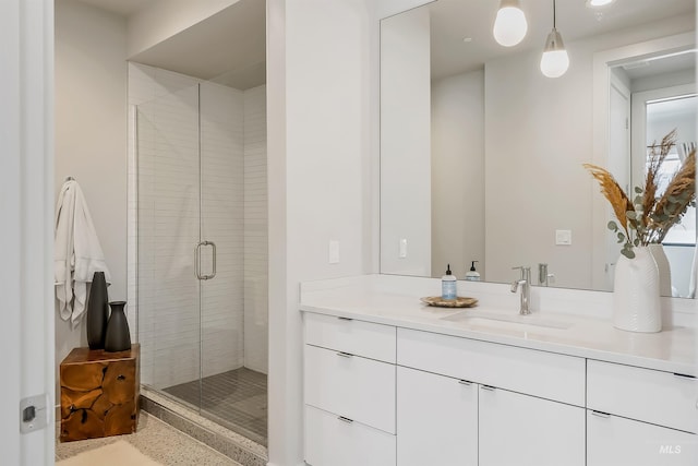 bathroom featuring vanity and a stall shower