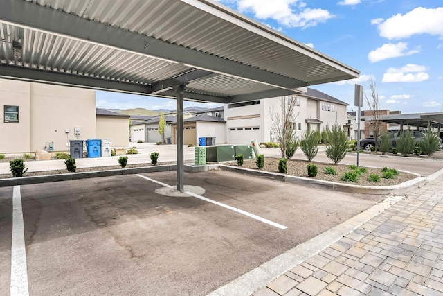 covered parking lot with a residential view