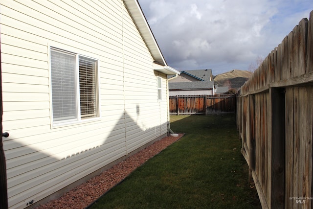 view of property exterior featuring a lawn