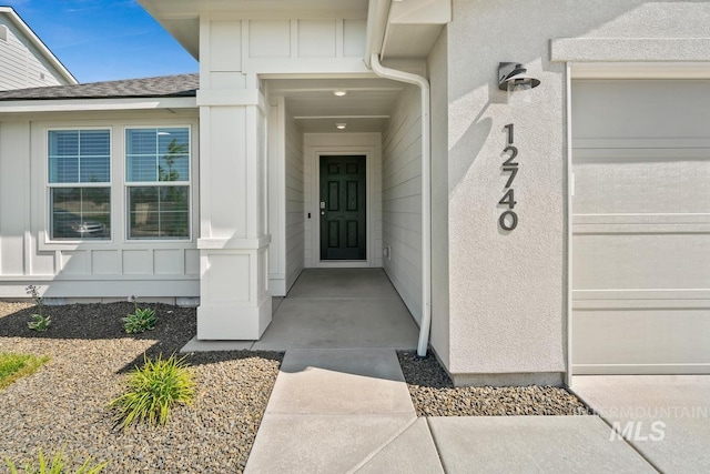 12740 Abbeygate Dr, Nampa, ID 83651 - entrance to property with board and batten siding and roof with shingles