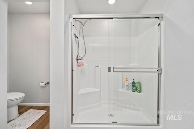 12740 Abbeygate Dr, Nampa, ID 83651 - bathroom with wood finished floors, a stall shower, and recessed lighting