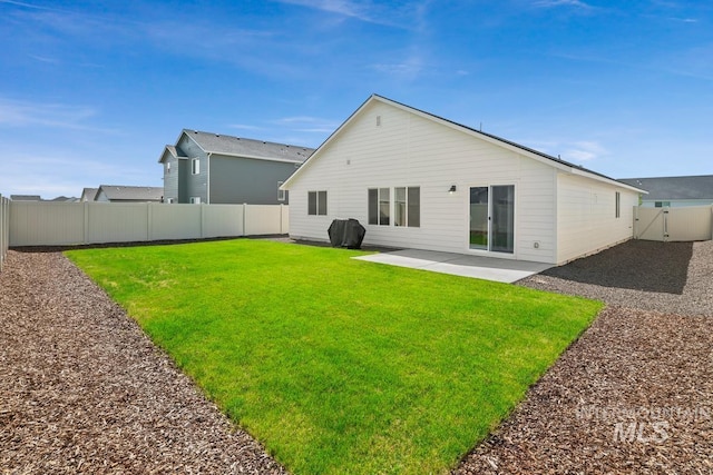 12740 Abbeygate Dr, Nampa, ID 83651 - back of property featuring a patio area and a fenced backyard