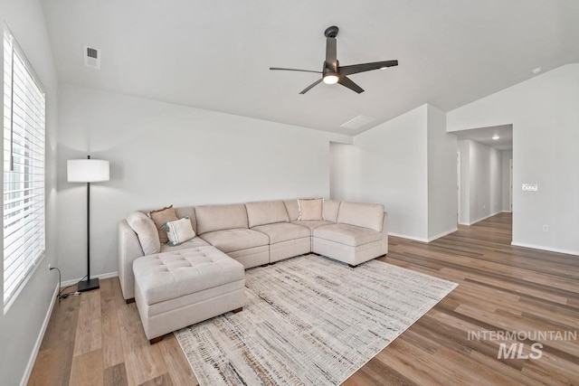 12740 Abbeygate Dr, Nampa, ID 83651 - living area with lofted ceiling, ceiling fan, and wood finished floors