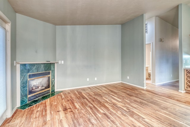 1921 Arcata Way, Ontario, OR 97914 - unfurnished living room with wood finished floors and a high end fireplace