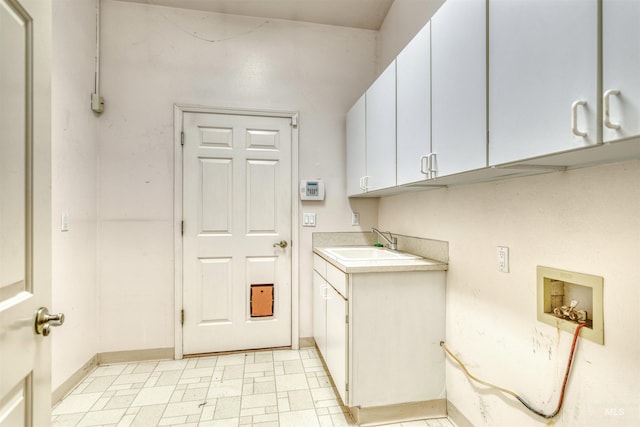 1921 Arcata Way, Ontario, OR 97914 - laundry room featuring cabinet space, washer hookup, and light flooring