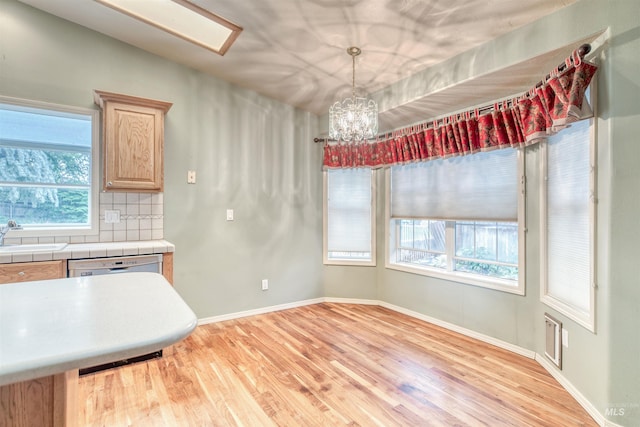 1921 Arcata Way, Ontario, OR 97914 - unfurnished dining area featuring light wood-type flooring and a chandelier