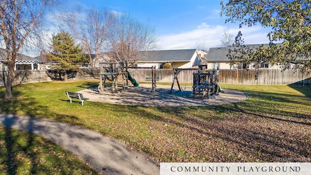 view of playground with a lawn