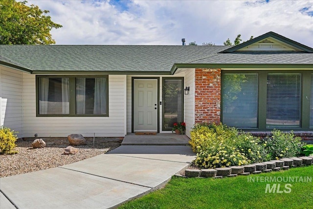 15103 Castle Way, Caldwell, ID 83607 - view of front of property featuring roof with shingles and brick siding