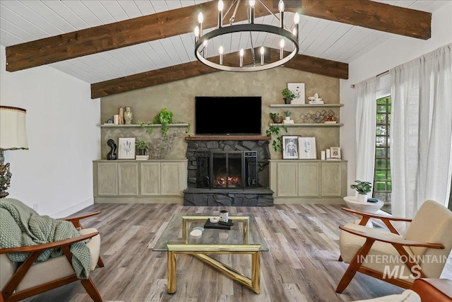 15103 Castle Way, Caldwell, ID 83607 - living room with a chandelier, a fireplace, wood finished floors, wooden ceiling, and baseboards