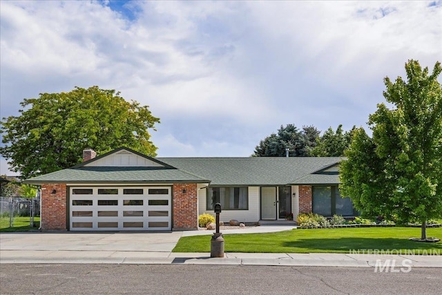 15103 Castle Way, Caldwell, ID 83607 - view of front of home featuring driveway, a garage, and brick siding
