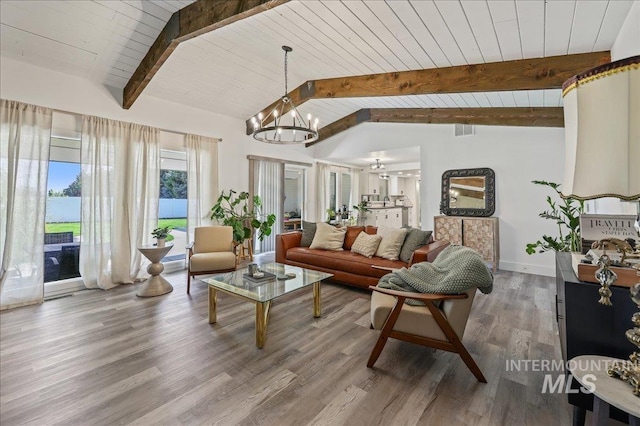 15103 Castle Way, Caldwell, ID 83607 - living area featuring a chandelier, wood finished floors, wood ceiling, and baseboards