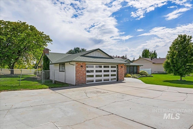15103 Castle Way, Caldwell, ID 83607 - view of front of home with driveway, brick siding, a chimney, and a garage