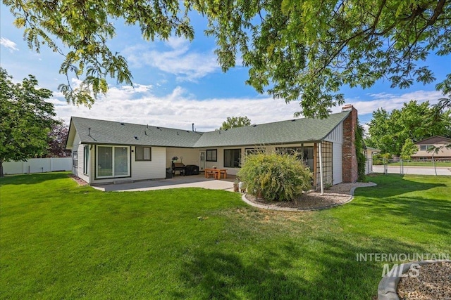 15103 Castle Way, Caldwell, ID 83607 - rear view of property featuring a patio area and a chimney