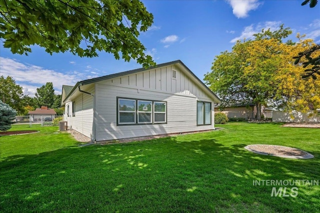 15103 Castle Way, Caldwell, ID 83607 - rear view of house with central AC unit and board and batten siding