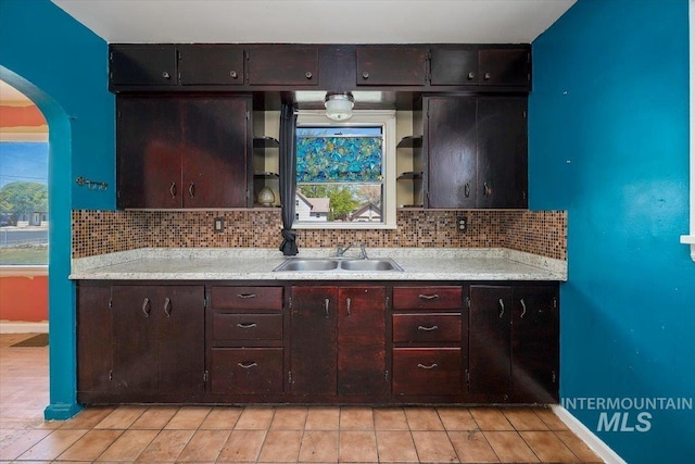 359 Falls Ave W, Twin Falls, ID 83301 - kitchen featuring a sink, open shelves, light countertops, and backsplash