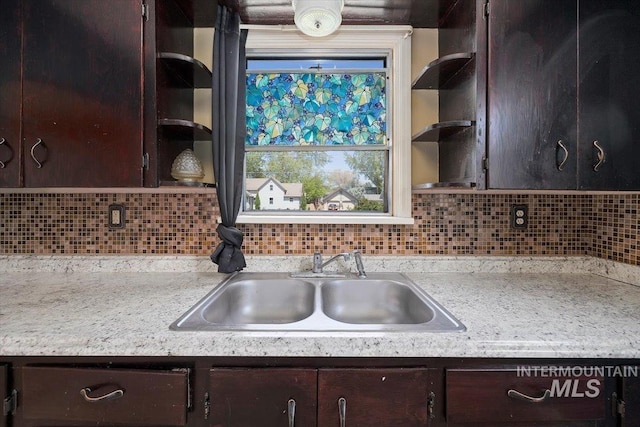 359 Falls Ave W, Twin Falls, ID 83301 - kitchen with open shelves, a sink, light countertops, and dark brown cabinets
