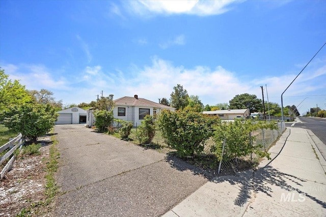 359 Falls Ave W, Twin Falls, ID 83301 - view of front facade featuring a garage, driveway, and an outdoor structure
