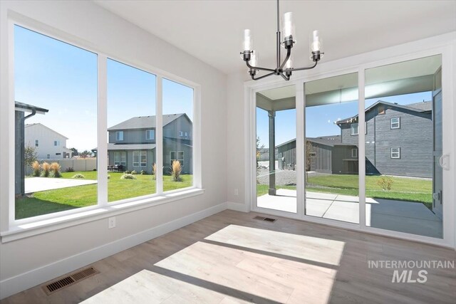 6150 S Binky Ave, Meridian, ID 83642 - unfurnished sunroom with a chandelier and a residential view