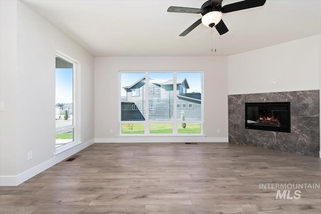 6150 S Binky Ave, Meridian, ID 83642 - unfurnished living room featuring wood finished floors and baseboards
