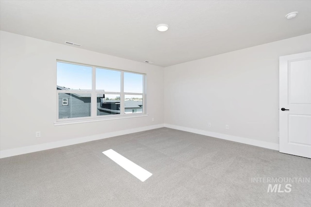 6150 S Binky Ave, Meridian, ID 83642 - carpeted empty room featuring baseboards and a smoke detector