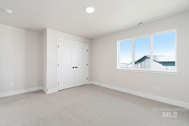6150 S Binky Ave, Meridian, ID 83642 - unfurnished bedroom featuring carpet, baseboards, and a closet