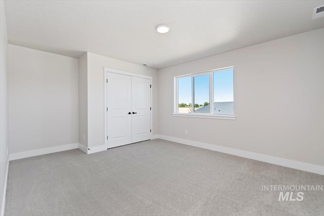 6150 S Binky Ave, Meridian, ID 83642 - unfurnished bedroom with carpet, baseboards, and a closet