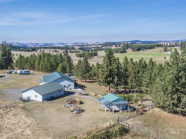 bird's eye view featuring a mountain view and a rural view