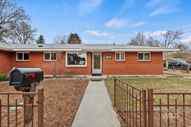 single story home with fence and brick siding