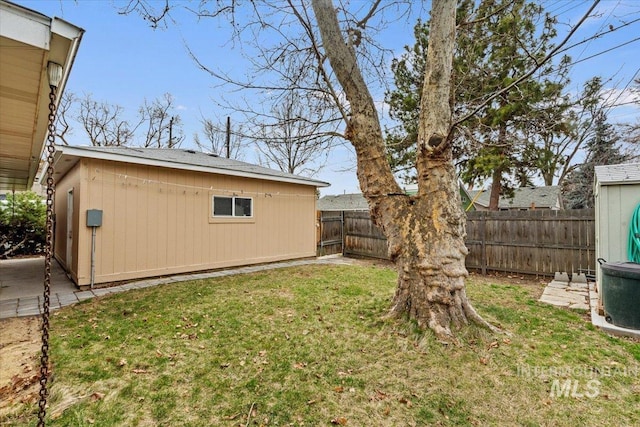 view of yard featuring an outbuilding and a fenced backyard