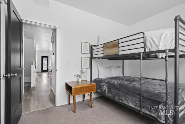 bedroom with hardwood / wood-style flooring