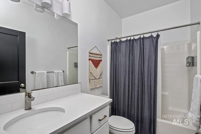 full bathroom with vanity, toilet, and shower / bathtub combination with curtain