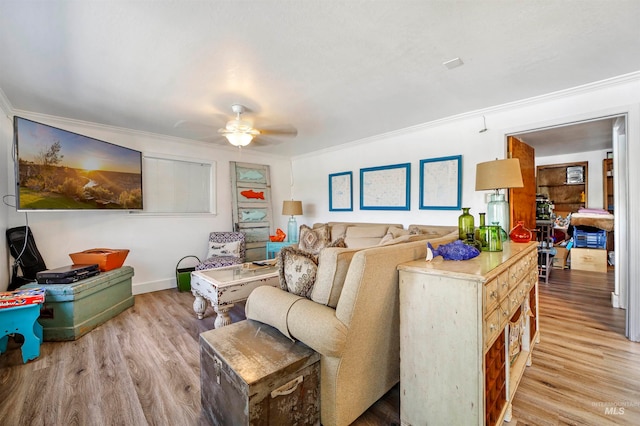 living room with ceiling fan, hardwood / wood-style flooring, and ornamental molding