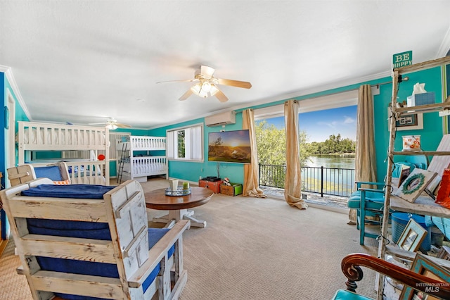 carpeted living room featuring crown molding, a water view, and ceiling fan