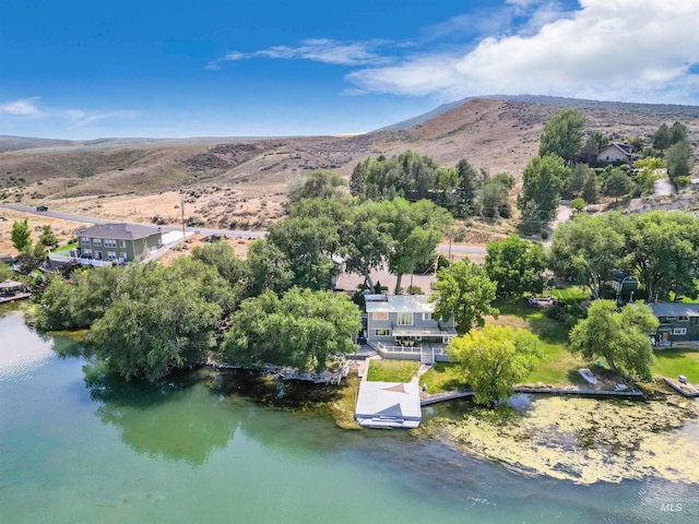 aerial view featuring a water and mountain view