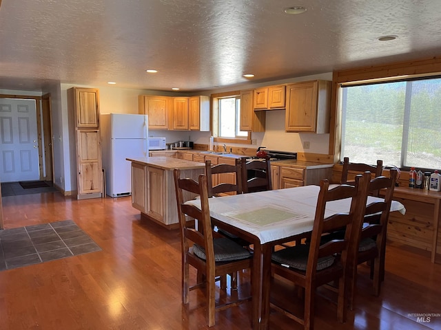 532 Warren Creek Rd, Warren, ID 83671 - kitchen featuring white appliances, a kitchen island, dark wood-style flooring, light countertops, and recessed lighting