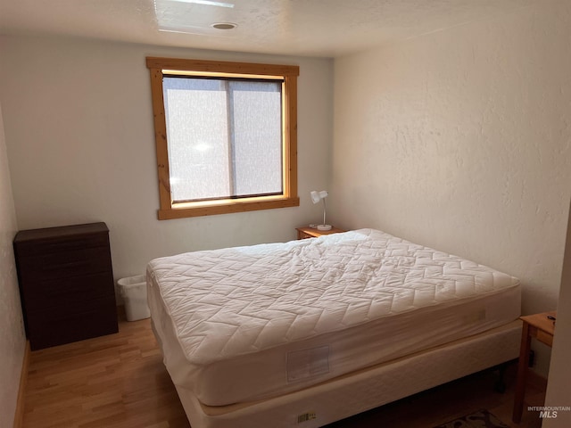 532 Warren Creek Rd, Warren, ID 83671 - bedroom with wood finished floors