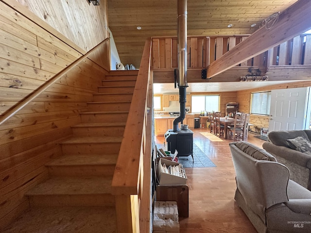 532 Warren Creek Rd, Warren, ID 83671 - stairway with a wood stove, wood ceiling, a high ceiling, wood finished floors, and wood walls