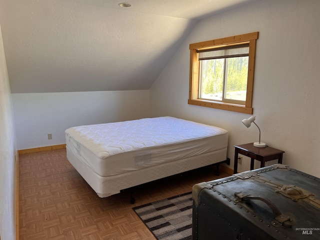 532 Warren Creek Rd, Warren, ID 83671 - bedroom with lofted ceiling and baseboards