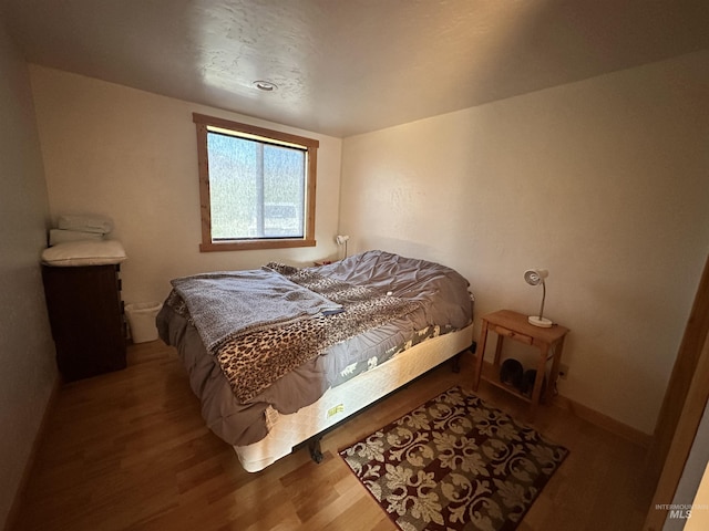 532 Warren Creek Rd, Warren, ID 83671 - bedroom with wood finished floors